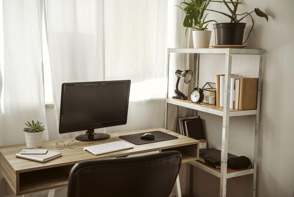 home office with shelving and plants